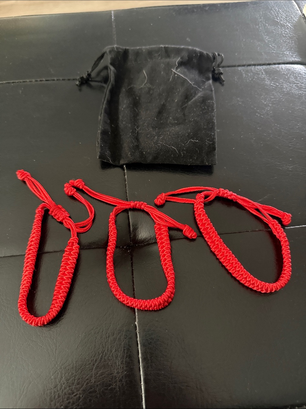 Set of Three Red Braided Cord Bracelets with Black Velvet Pouch for $15 or $7 ea